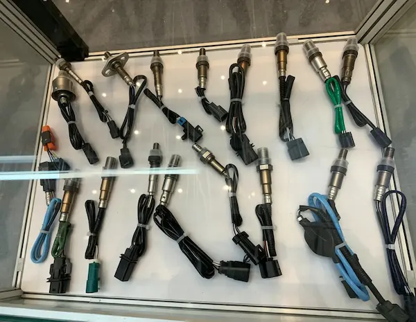 Aftermarket oxygen sensors in a glass box