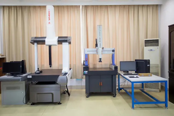 A Coordinate Measuring Machine (CMM) measuring an auto part